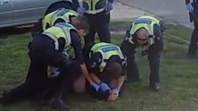 Victoria Police officers pinning down a Melbourne disability pensioner.