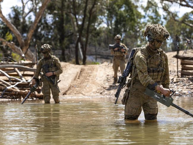 Australian Army sappers from the 3rd Combat Engineer Regiment sweep for mines on an obstacle crossing on Exercise Brolga Sprint 23 at Townsville Field Training Area, Queensland. PHOTO: LCPL Riley Blennerhassett