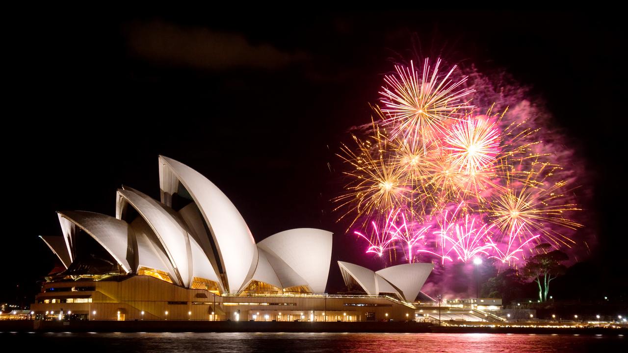 Fireworks erupt behind the Sydney Opera House at night. Picture: iStock