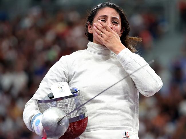 PARIS, FRANCE - JULY 29: Nada Hafez of Team Egypt shows emotion after her victory against Elizabeth Tartakovsky of Team United States (not pictured) in the Fencing Women's Sabre Individual Table of 32 on day three of the Olympic Games Paris 2024 at Grand Palais on July 29, 2024 in Paris, France. (Photo by Al Bello/Getty Images)