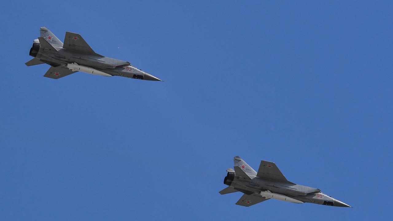 Russia's MiG-31 jets carrying hypersonic Kinzhal missiles flying over Red Square during the Victory Day military parade in Moscow on May 9, 2018. Picture: AFP