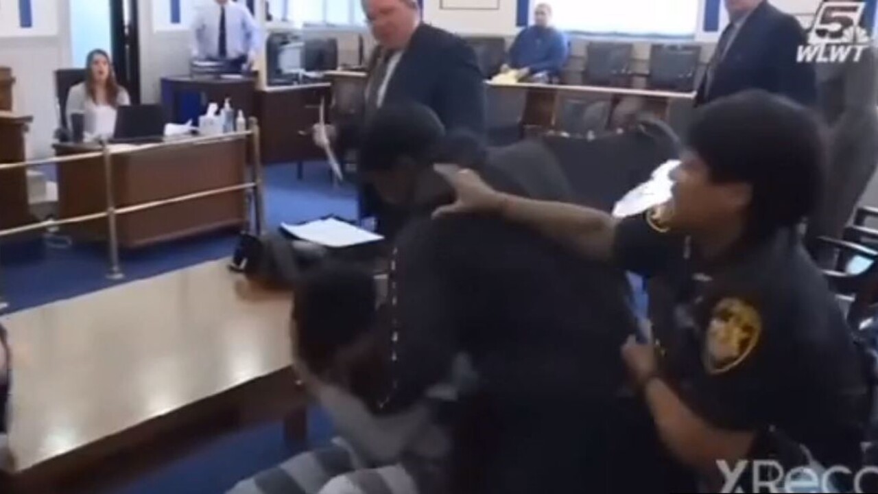 Father attacks the man accused of killing his son in a court room