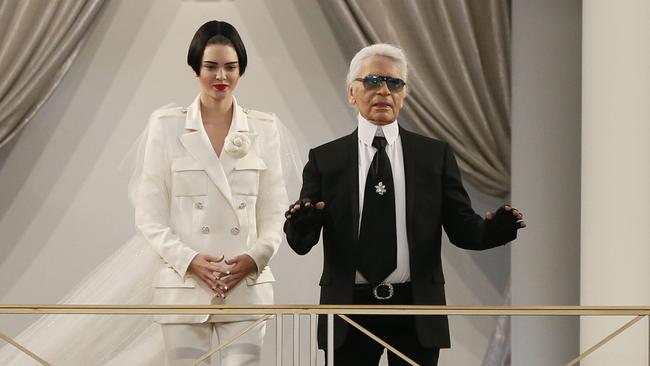 Commanding attention ... Kendall and Karl Lagerfeld. Picture: AFP