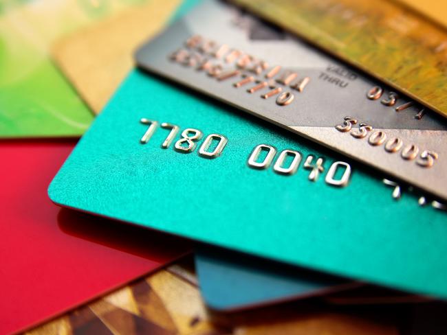 stack of multicolored credit cards, close up view with selective focus