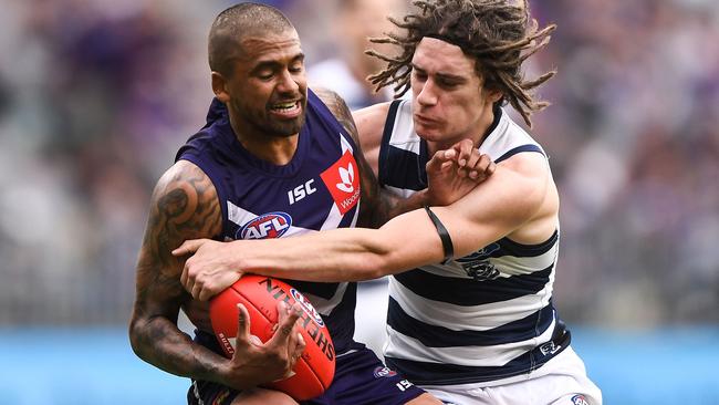 PERTH, AUSTRALIA - AUGUST 03: Bradley Hill of the Dockers is tackled by Gryan Miers of the Cats during the 2019 AFL round 20 match between the Fremantle Dockers and the Geelong Cats at Optus Stadium on August 03, 2019 in Perth, Australia. (Photo by Daniel Carson/AFL Photos via Getty Images)