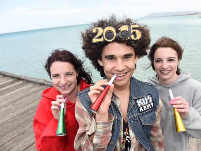 Taylah Giampa 17, Michael Zachariou 16 and Rhiannon Giampa 16, at Rye foreshore, look forward to seeing in 2015 on the Peninsula. Picture: Jason Sammon