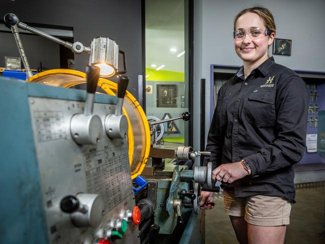 Year 12 student Alana works a lathe in the engineering room. Picture: Jake Nowakowski