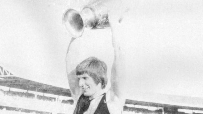 Royce Hart holds up the premiership cup from the 1973 Grand Final against Carlton.