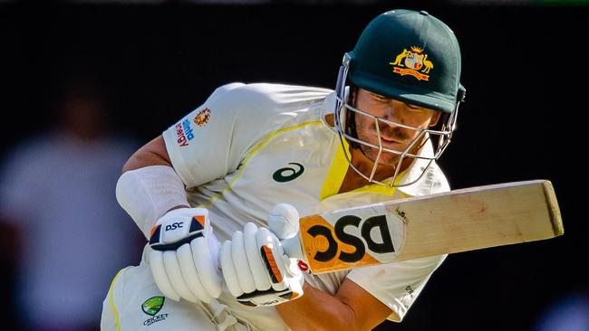 Australia's David Warner ducks under a rising delivery during the second day of the first cricket Test match between Australia and South Africa at the Gabba in Brisbane on December 18, 2022. (Photo by Patrick HAMILTON / AFP) / – IMAGE RESTRICTED TO EDITORIAL USE – STRICTLY NO COMMERCIAL USE-