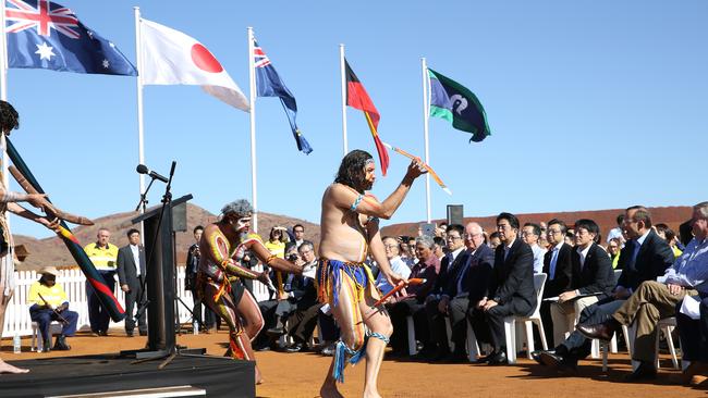 Enjoying a dance ... Prime Minister Tony Abbott and the Japanese Prime Minister Shinzo Abe at a ceremony with traditional dancers Olman Walley, Theo Kearing and John Walley. Picture: Gary Ramage