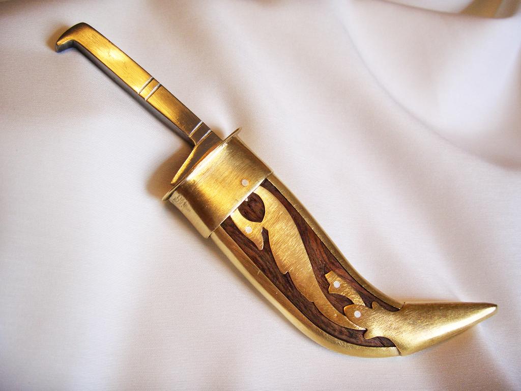 An example of a Kirpan, a type of religious dagger, worn at all times by Baptised Sikhs.