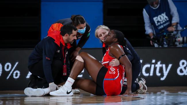 Wallace is assisted my medical staff after rupturing her ACL in the opening Super Netball round last year. Photo: Narelle Spangher, Netball NSW