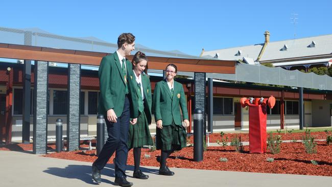 FRESH FACE: Ryan Pike, Hanna McIvor and Luci Donovan walk through the new school entry at Assumption College.