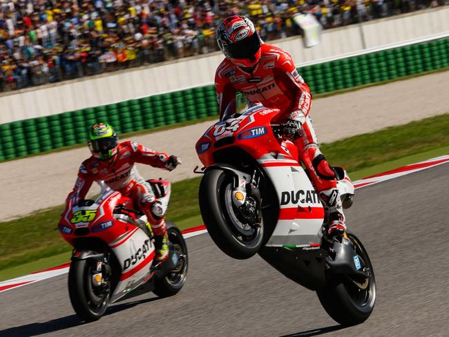 Andrea Dovizioso celebrates after the San Marino MotoGP.