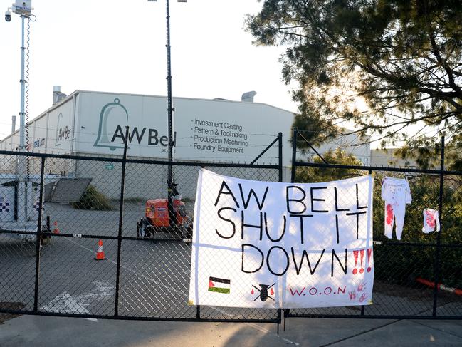 A pro-Palestine sign is draped on the factory gate. Picture: Andrew Henshaw