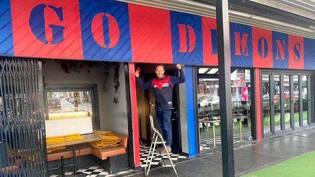 Morris Jones owner Hayden Burbank dresses up closed bar in Demons colours ahead of the grand final. Picture: Instagram