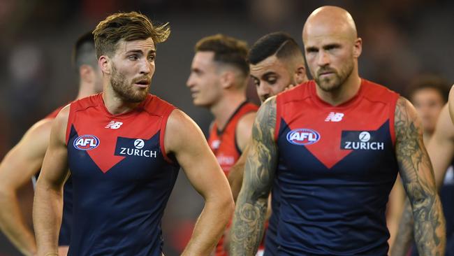 Jack Viney and Nathan Jones walk off the MCG after the Demons slumped to their  third loss of the season. Picture: AAP