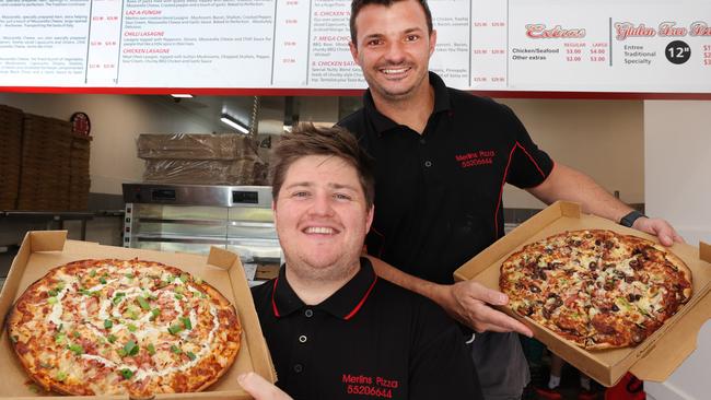 Merlins Pizza has been named the best on the Gold Coast. Co-owners Jordan Powell and Scott Jelich with some of their tasty treats. Picture Glenn Hampson