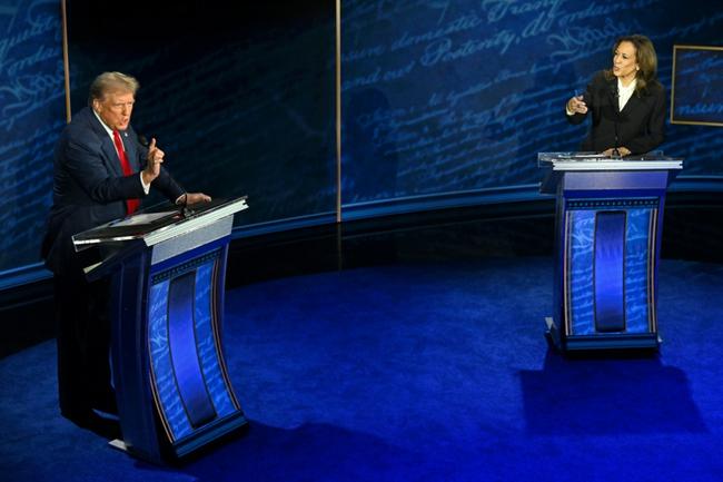 US Vice President and Democratic presidential candidate Kamala Harris (R) and former US President and Republican presidential candidate Donald Trump speak during a presidential debate in Philadelphia, Pennsylvania, on September 10, 2024