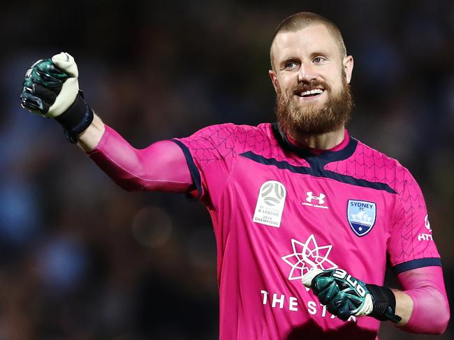 SYDNEY, AUSTRALIA - DECEMBER 07: Andrew Redmayne of Sydney celebrates team mate Adam Le Fondre  scoring a goal during the round nine A-League match between Sydney FC and the Brisbane Roar at Netstrata Jubilee Stadium on December 07, 2019 in Sydney, Australia. (Photo by Brendon Thorne/Getty Images)