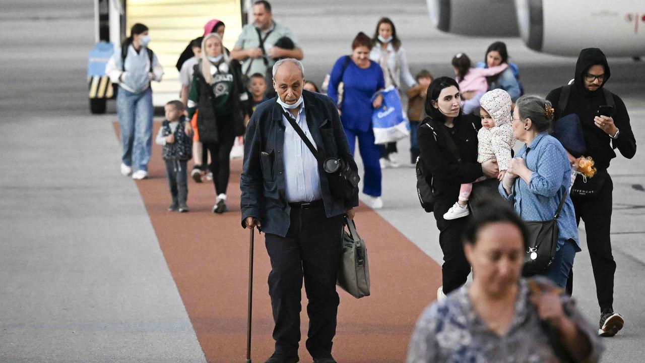 Passengers disembark a Bulgarian government evacuation flight from Lebanon at Sofia International Airport in Bulgaria on Monday. Picture: Nikolay Doychinov / AFP