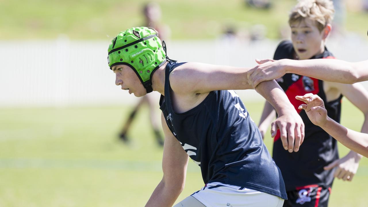 Cameron Dennis looks to get possession for Coolaroo against South Toowoomba Bombers in U14 AFL Darling Downs grand final at Rockville Park, Saturday, September 2, 2023. Picture: Kevin Farmer