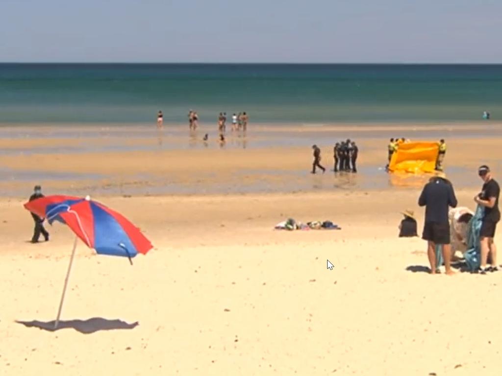 The man rushed into the water as his daughter drifted out to sea. Picture: 7 News