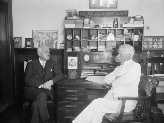 Macpherson Robertson (right) welcomes Professor Moody to his Macpherson's chocolate factory in Fitzroy in the early 1900s. Picture: State Library of Victoria.