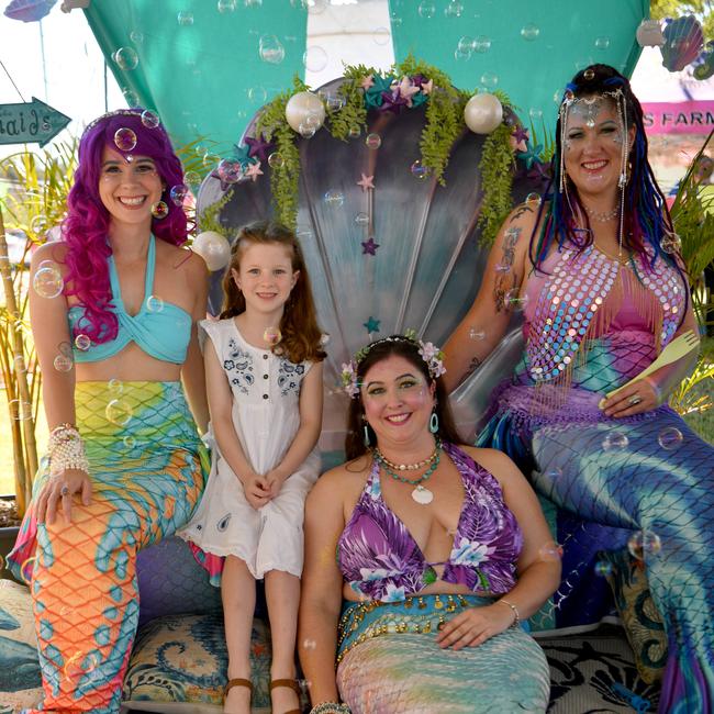 Townsville Medieval and Fantasy Festival 2024 at Cluden. Ida Daley, 7, with mermaids Danielle Fuller, Kate Archer and Gypsy Jardine. Picture: Evan Morgan