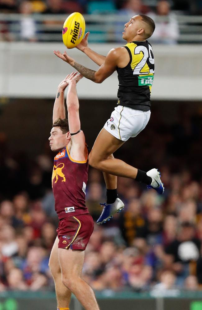 Richmond’s Shai Bolton soars for a screamer over Brisbane’s Lachie Neale. Picture: AFL Photos