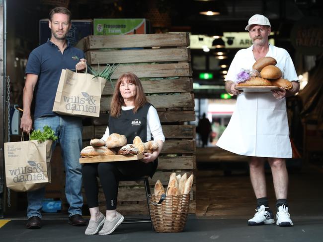 30.3.2020.Skala has set up a new pop up delivery site in a bid to keep jobs and help shoppers avoid (increasingly agro) crowds.Dan Temmler of  Wills & Daniels and Sally Hansen and Roland Pauls of Skala at the Adelaide Central Markets. PIC TAIT SCHMAAL.