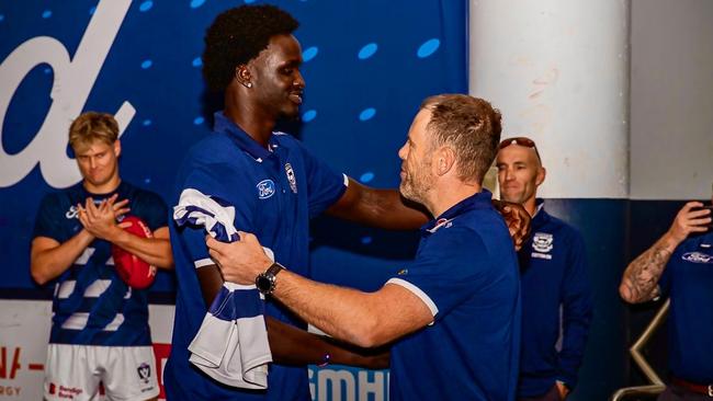 Ajang Kuol mun receives his jumper ahead of his debut. Picture: Arj Giese