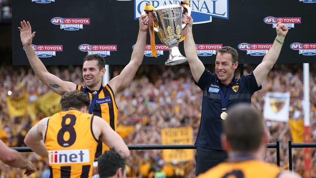 Luke Hodge and Alastair Clarkson lift the 2015 premiership cup. Picture: Wayne Ludbey