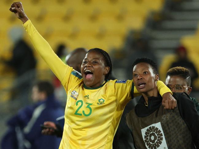 South Africa's forward #23 Wendy Shongwe (L) celebrates with teammates their win at the end of the Australia and New Zealand 2023 Women's World Cup Group G football match between South Africa and Italy at Wellington Stadium in Wellington on August 2, 2023. (Photo by Marty MELVILLE / AFP)