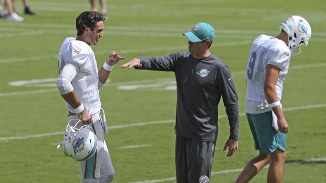 Miami Dolphins head coach Adam Gase gives instruction to Dolphins quarterback Brock Osweiler. Picture: AP