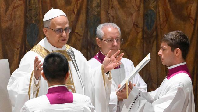 Newly elected Pope Leo XIV says mass with the cardinals in the Sistine Chapel on Friday. He spoke of the difficulty of preaching the gospel when believers were at best tolerated and pitied. Picture: Vatican Media / AFP