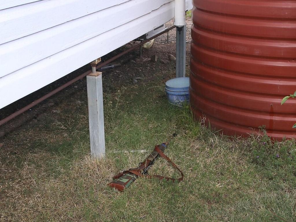 A rifle found near a water tank by the Train’s house.