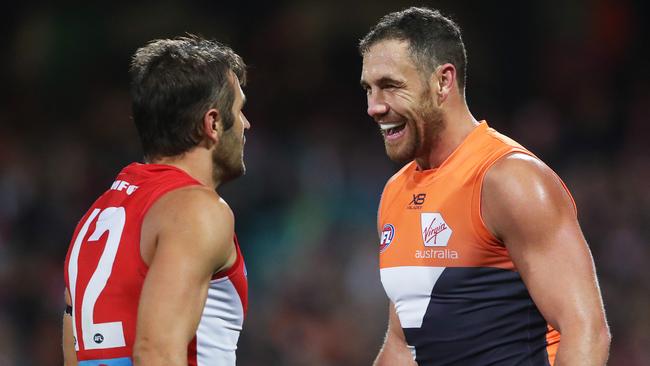 Giants Shane Mumford comes together with Sydney's Josh Kennedy