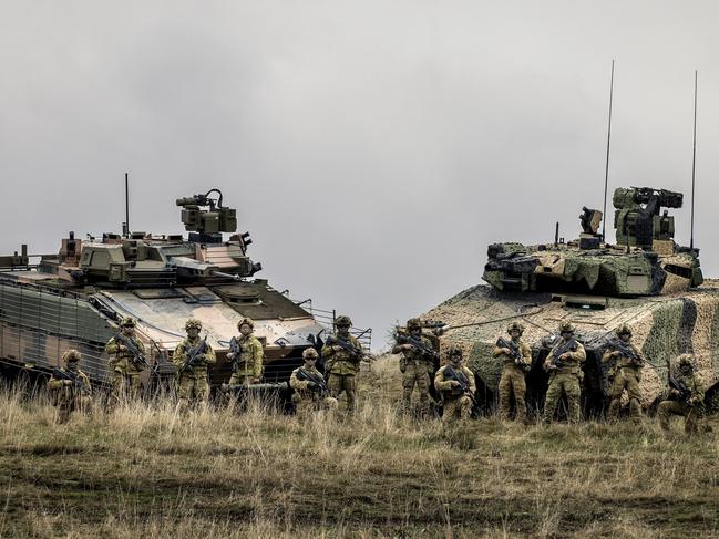 Australian Army soldiers from the 7th Battalion, Royal Australian Regiment, stand with Hanwha Defence Australia Redback Infantry fighting vehicle (left) and Rheinmetall Lynx KF4 Infantry Fighting Vehicle (right), during user evaluation trials at Puckapunyal, Victoria. Picture: ADF.