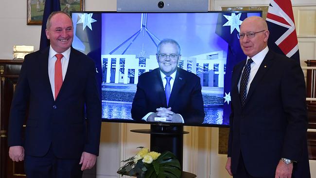 Re-elected Leader of the Nationals Barnaby Joyce poses for photographs with Prime Minister Scott Morrison after being sworn in by Governor-General David Hurley at Government House. Picture: Getty Images