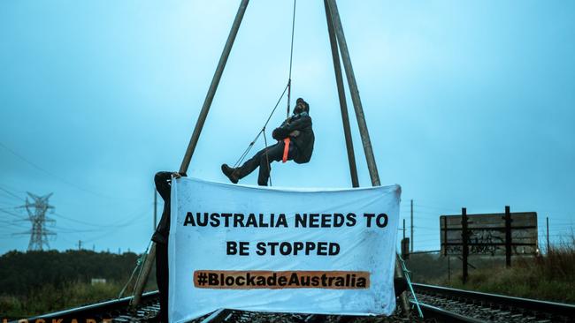 Monday’s post of protester climbing a tripod on a train line into and out of Newcastle coal port. Picture: Blockade Australia/Facebook