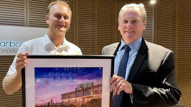 Shellharbour mayor Chris Homer (left) presented outgoing CEO Carey McIntyre with a framed picture of the Civic Centre, one of the projects he oversaw, as a farewell gift. Picture: Dylan Arvela