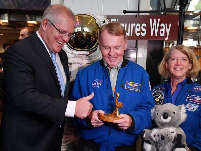 Australia's Prime Minister Scott Morrison, astronaut Andy Thomas (holding a Logie) and Austronaut Pam Melroy at the NASA headquarters in Washington DC. Picture: AAP,