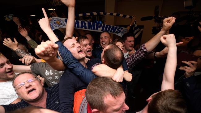 Leicester City fans celebrate their team becoming the English Premier League champions.