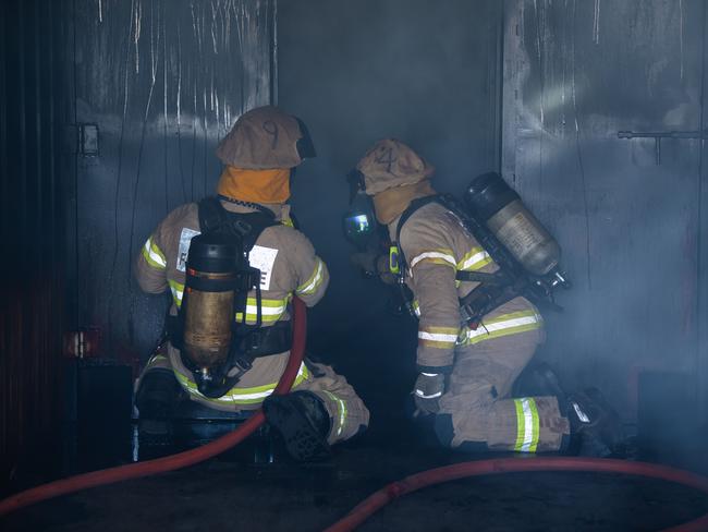 MFS fire fighters conduct a simulation at the launch of the Australian-first structural fire behaviour training facility, on April 20th, 2021, at Angle Park.Picture: Tom Huntley