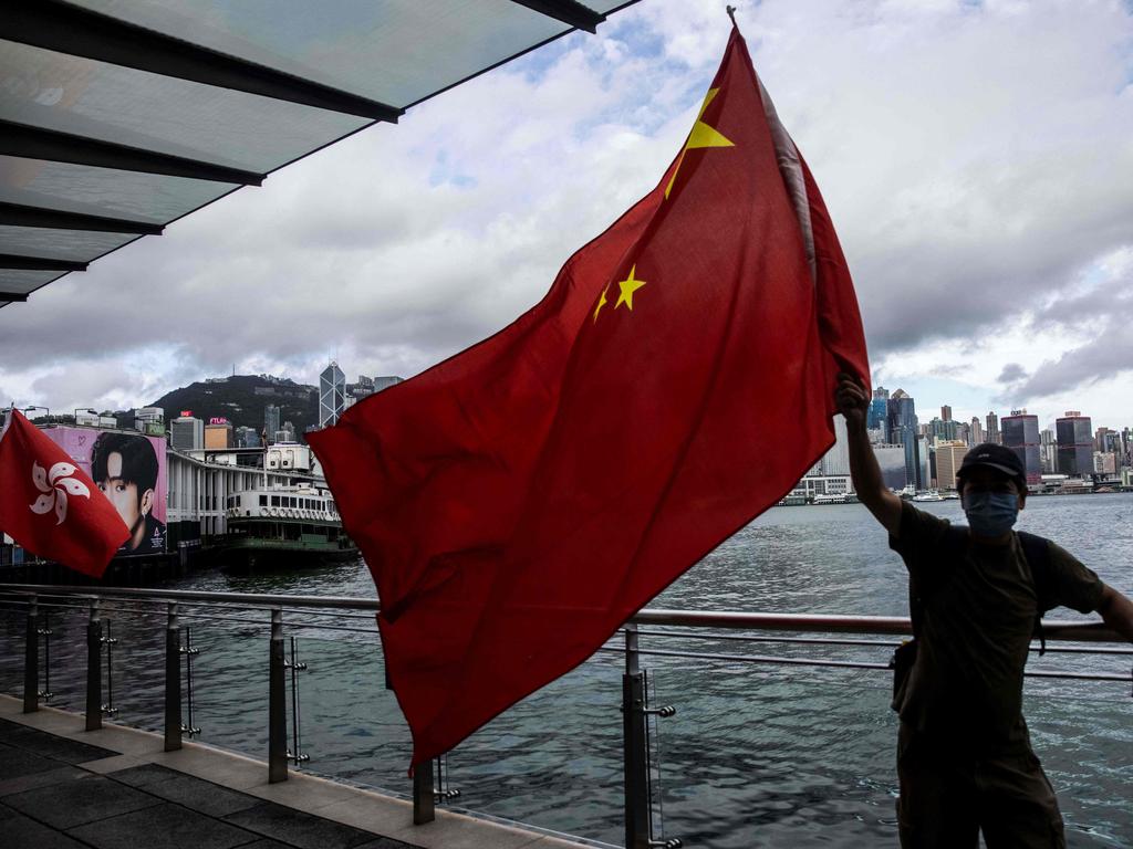 A man celebrates the 25th anniversary of Hong Kong’s handover to China. Picture: Isaac Lawrence/AFP