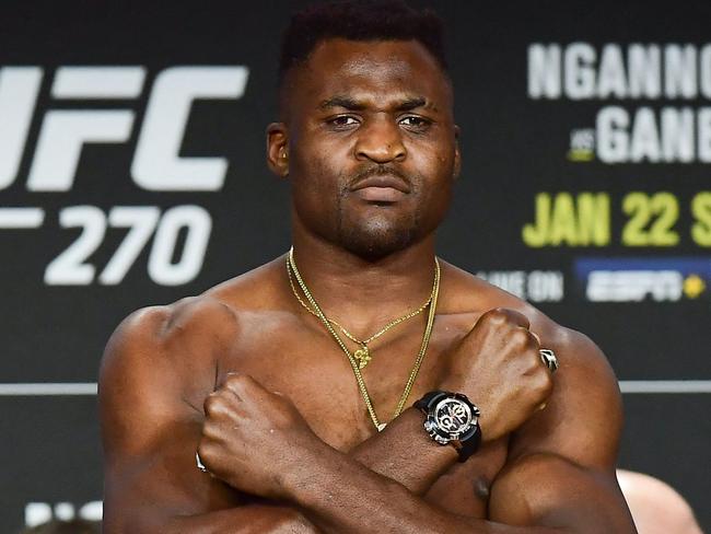 Reigning UFC Heavyweight Champion French Cameroonian mixed martial artist Francis Ngannou crosses his arms on his chest during weigh-in at the Anaheim Convention Center in Anaheim, California on January 21, 2022. (Photo by FREDERIC J. BROWN / AFP)