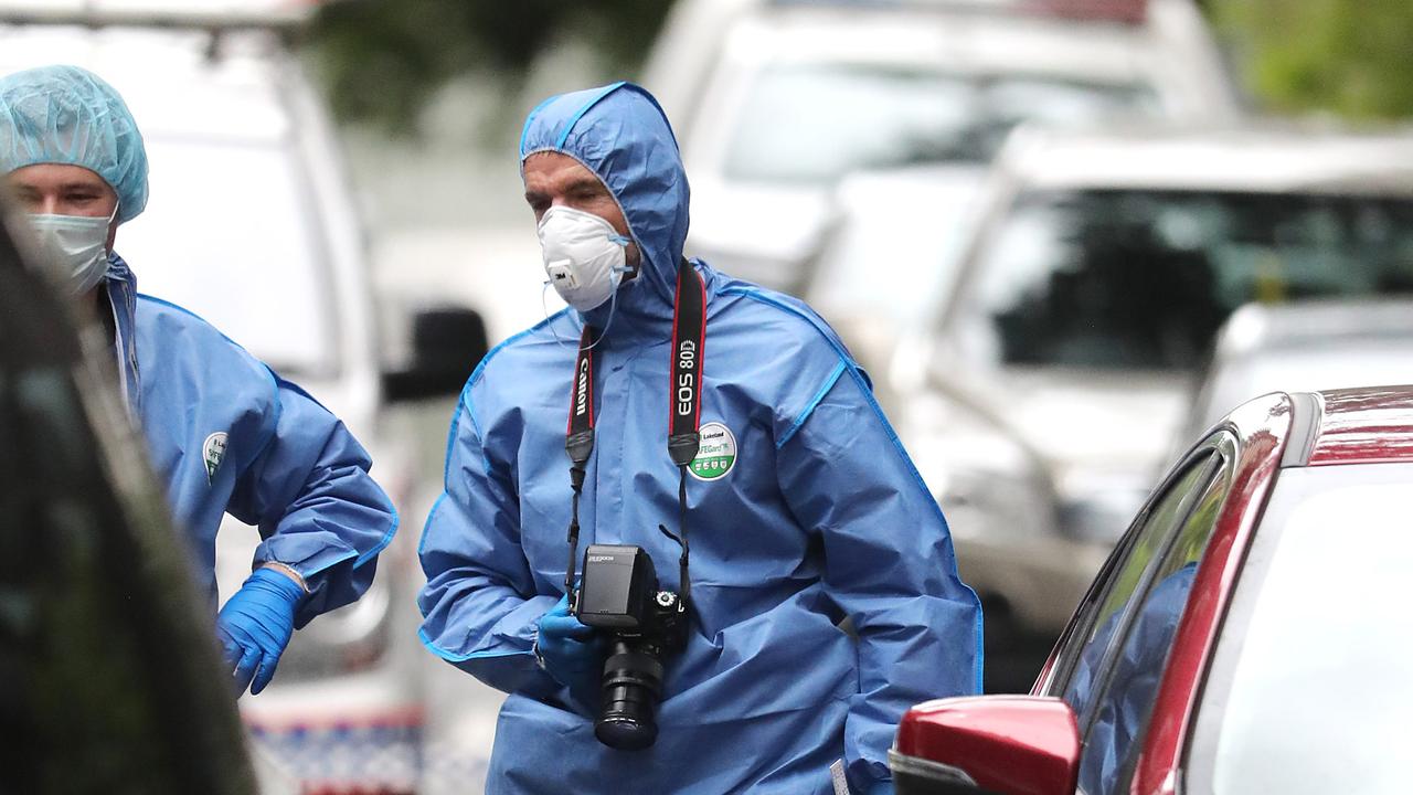 A police officer stands over a kni\\fe at the scene. Police at the scene of a shooting in Mary Street in the Brisbane CBD. Pic Peter Wallis