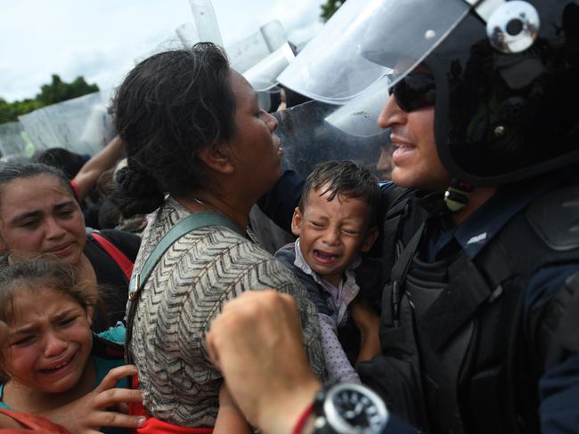 A Honduran mother begs to be allowed to enter the United States in 2018. Picture: AFP