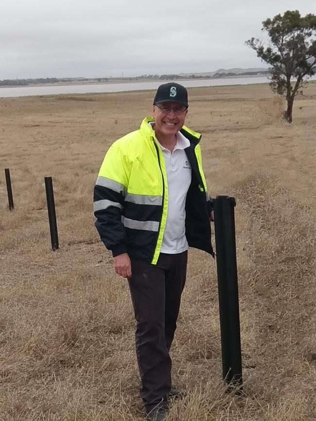 Flexible: David Hodge from Plastic Forests with the fence posts made out of recycled farm plastics. Picture: Supplied